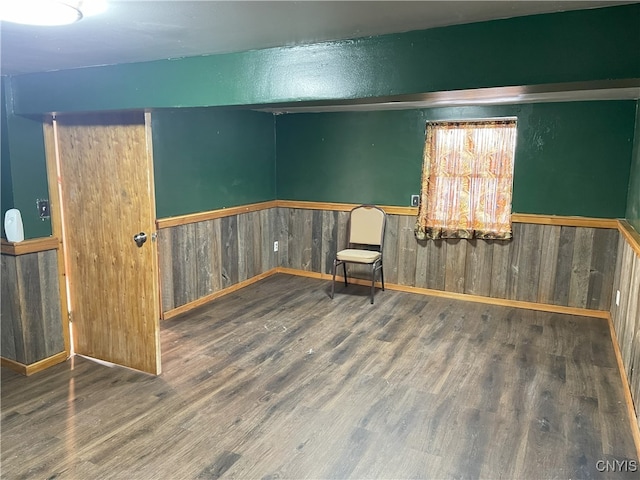 spare room featuring wood-type flooring