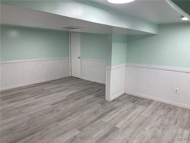 basement featuring light hardwood / wood-style floors