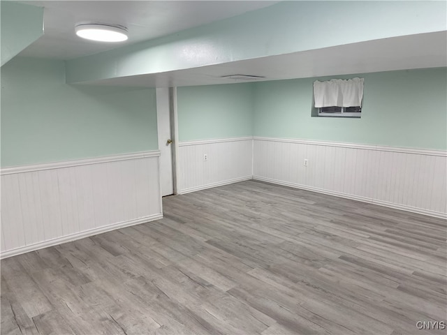 basement with light wood-type flooring