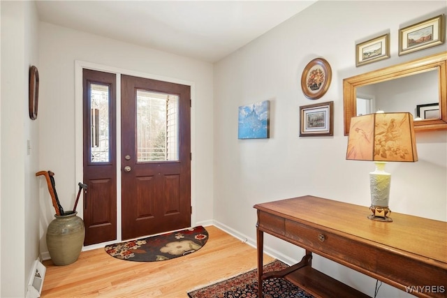 entryway with hardwood / wood-style floors