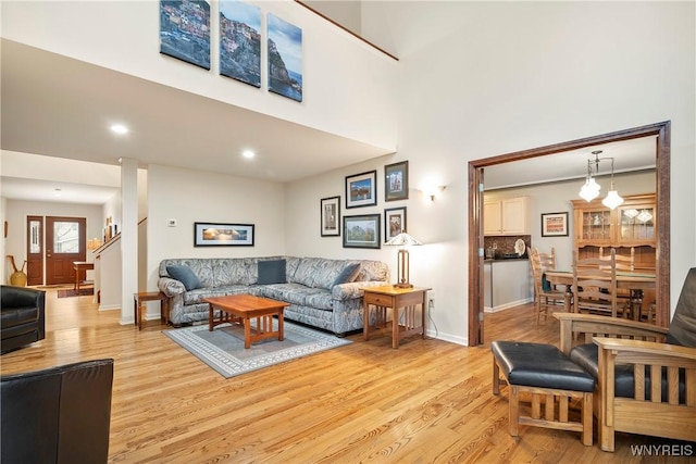 living room with light hardwood / wood-style flooring