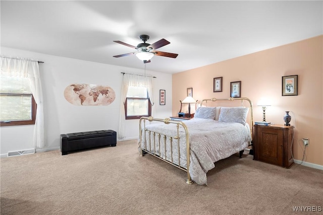 bedroom with light carpet and ceiling fan