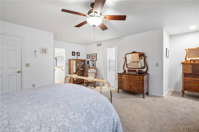 bedroom with ceiling fan and light carpet