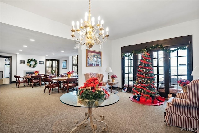 carpeted dining room with a notable chandelier