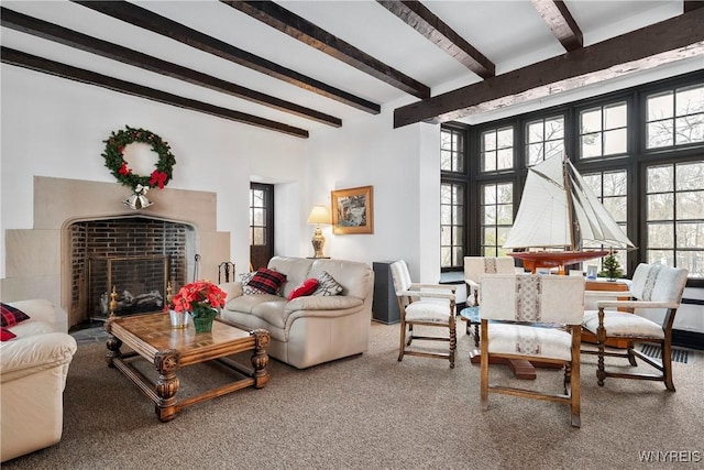 living room with carpet floors and beamed ceiling