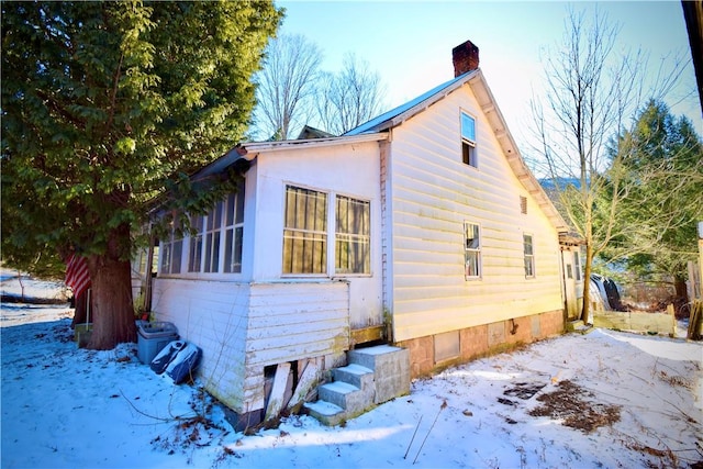 view of snow covered property