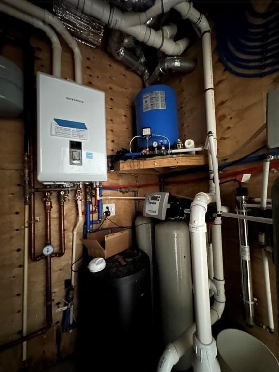 utility room featuring tankless water heater