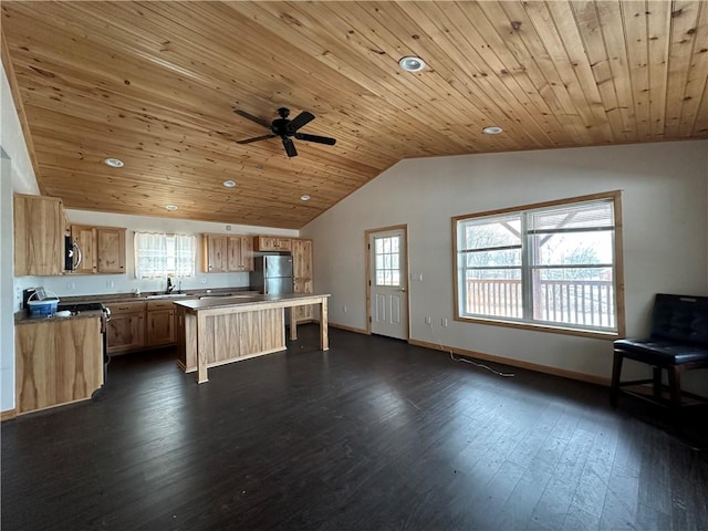 kitchen with a center island, wood ceiling, dark hardwood / wood-style floors, and appliances with stainless steel finishes