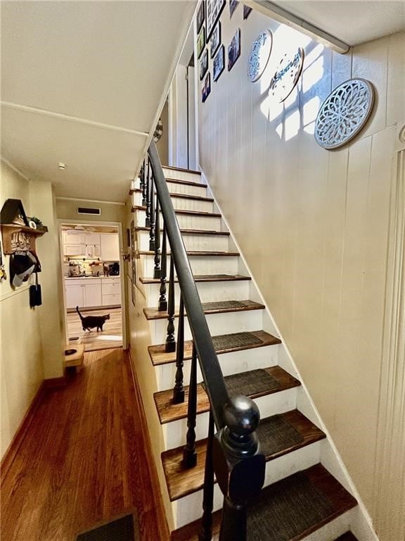 stairway featuring hardwood / wood-style flooring