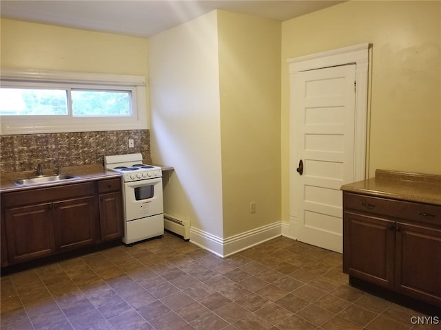 kitchen featuring dark brown cabinetry, sink, a baseboard radiator, white range oven, and backsplash