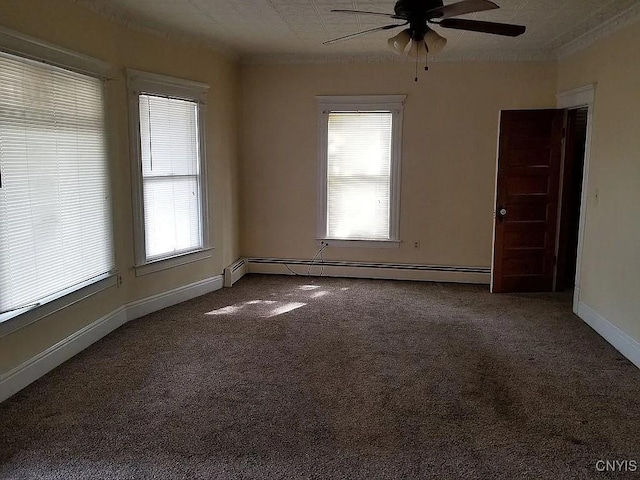 spare room featuring carpet floors, baseboard heating, and ceiling fan