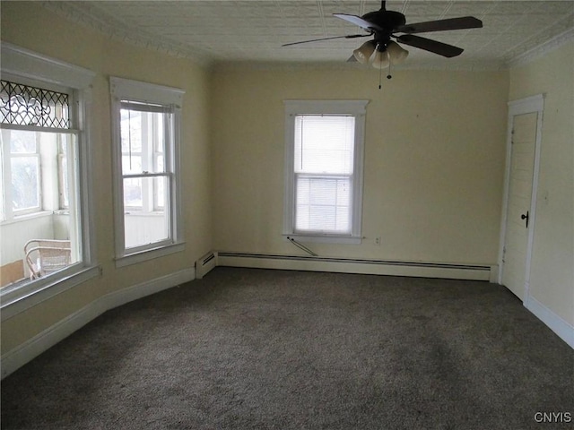 spare room with dark colored carpet, ceiling fan, and a baseboard heating unit