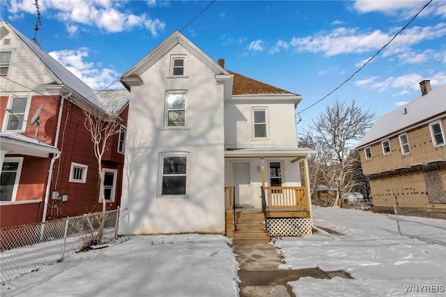 view of snow covered house