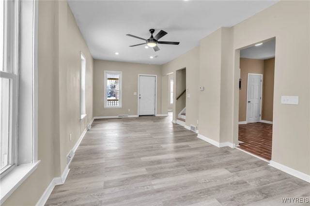 foyer featuring ceiling fan and light wood-type flooring