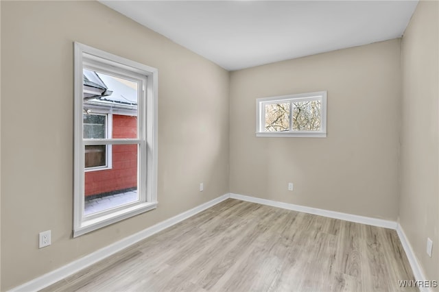 unfurnished room featuring light wood-type flooring