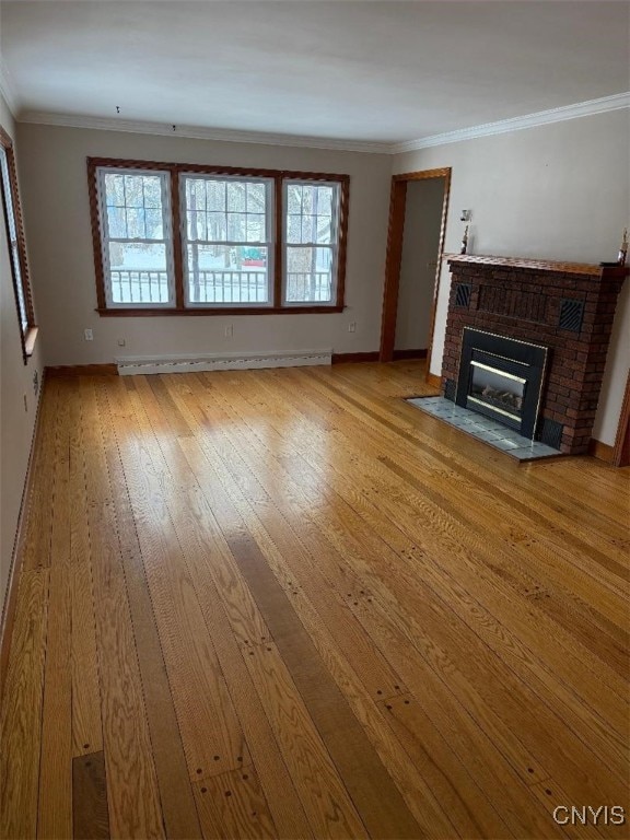 unfurnished living room featuring a brick fireplace, a baseboard radiator, light wood-type flooring, and ornamental molding