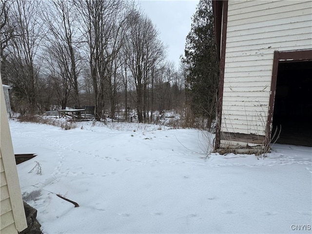 view of yard layered in snow