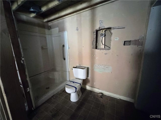 bathroom with walk in shower and toilet