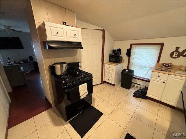 kitchen with lofted ceiling, black appliances, white cabinets, light tile patterned floors, and baseboard heating