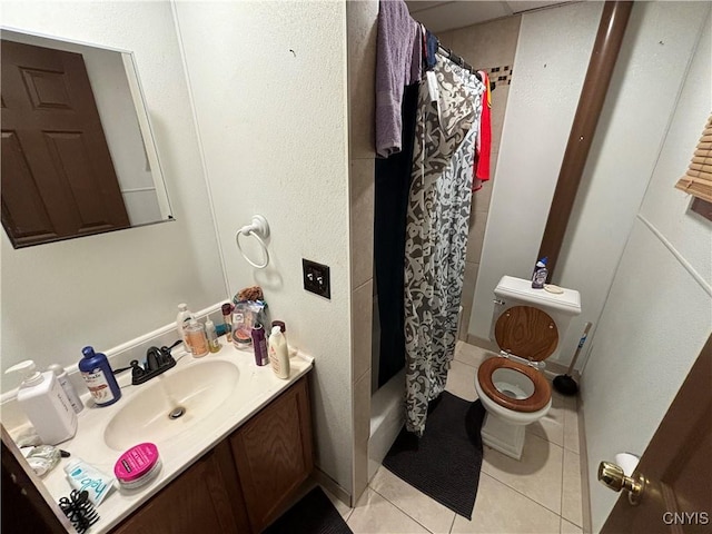 bathroom with tile patterned flooring, vanity, curtained shower, and toilet