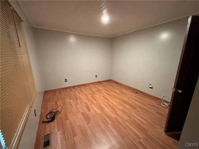 spare room featuring hardwood / wood-style flooring