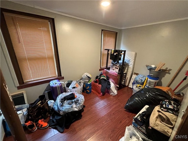 bedroom featuring hardwood / wood-style flooring and crown molding