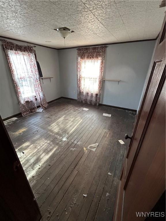 spare room featuring dark wood-type flooring