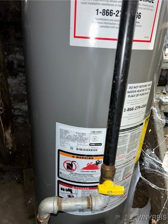 utility room featuring gas water heater