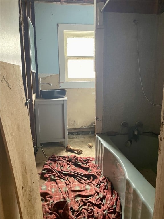 bathroom with vanity and shower / washtub combination