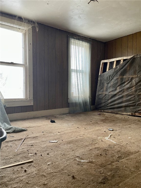 interior space featuring wood walls