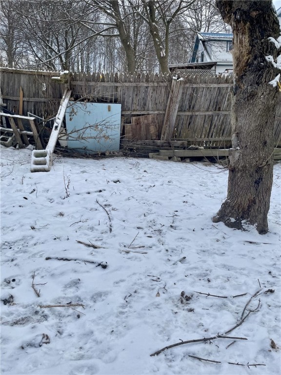 view of yard layered in snow