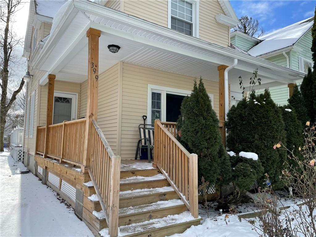 view of snow covered property entrance