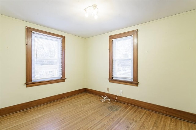 empty room featuring light hardwood / wood-style floors and a healthy amount of sunlight