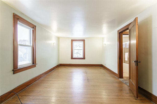 unfurnished room with plenty of natural light and light wood-type flooring