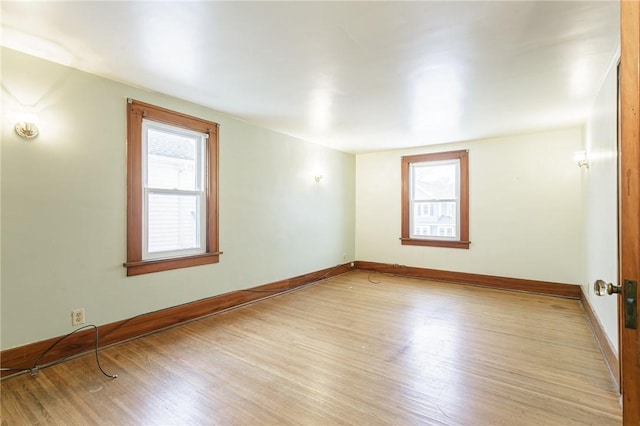 spare room featuring light wood-type flooring