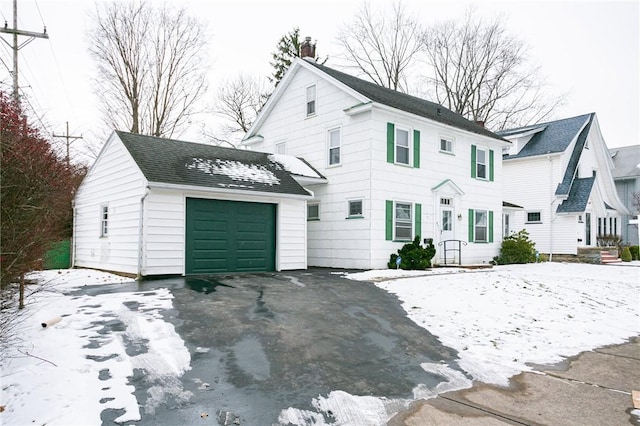 view of front of property with an outdoor structure and a garage