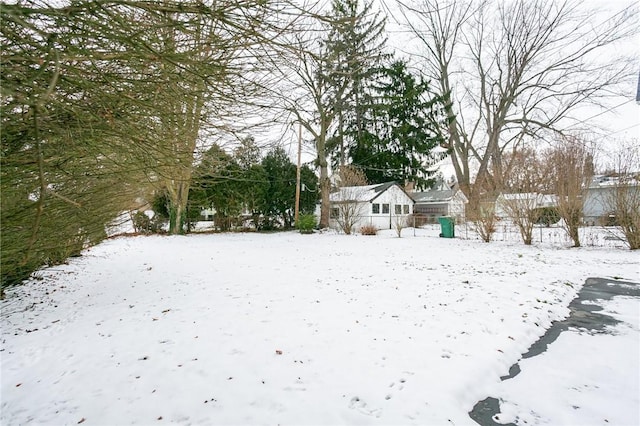 view of yard layered in snow