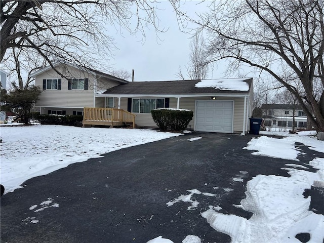 split level home with a garage and a deck