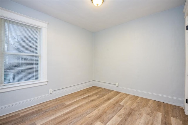 spare room with light hardwood / wood-style floors