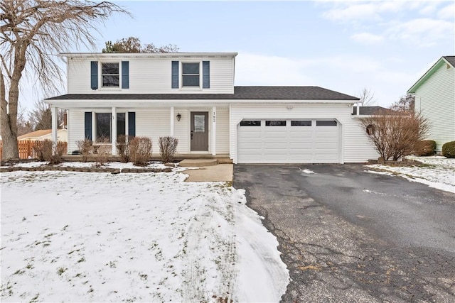 front facade with a garage