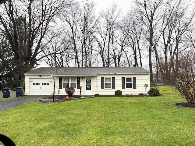 ranch-style house with a front lawn and a garage