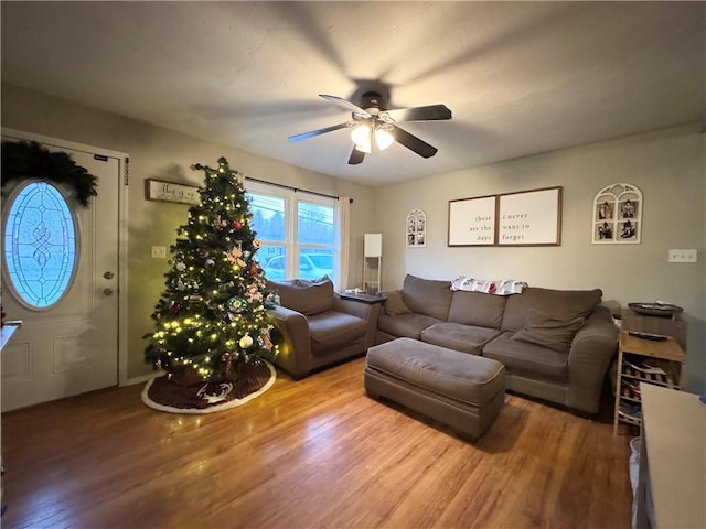 living room featuring hardwood / wood-style flooring and ceiling fan