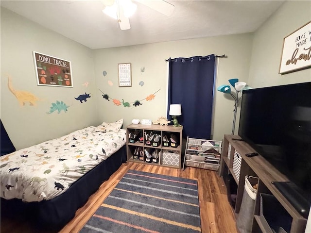 bedroom featuring ceiling fan and dark hardwood / wood-style flooring