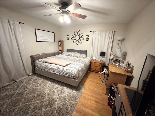 bedroom featuring hardwood / wood-style floors and ceiling fan