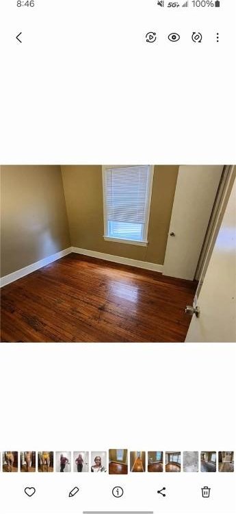 spare room with hardwood / wood-style flooring