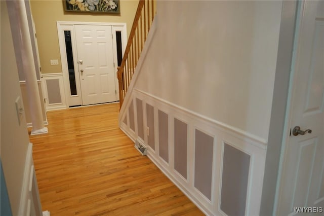 corridor featuring light hardwood / wood-style floors