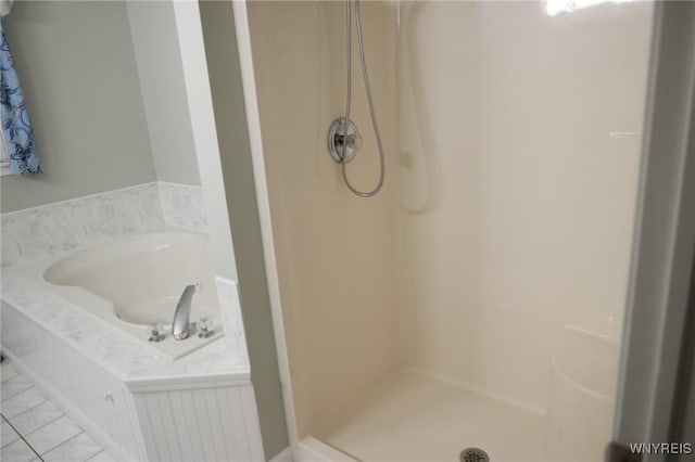 bathroom featuring tile patterned floors and walk in shower