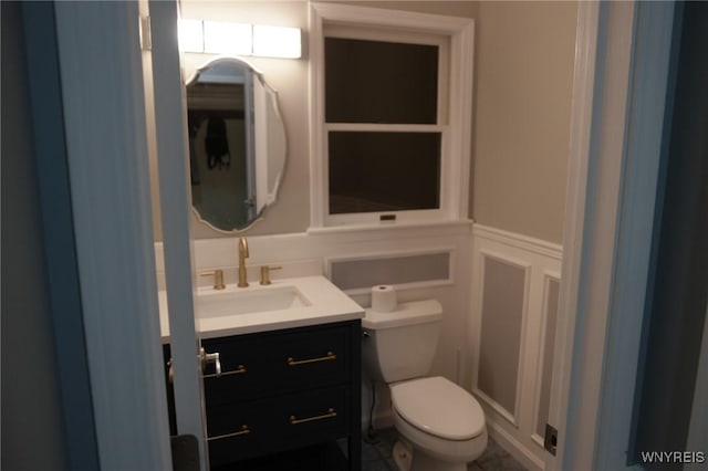 bathroom with vanity and toilet