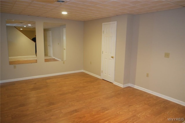 basement featuring hardwood / wood-style floors