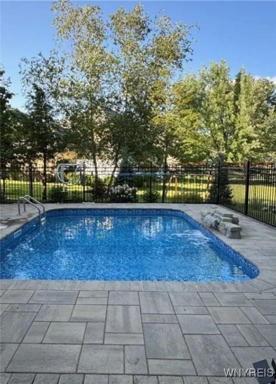 view of swimming pool featuring a patio area